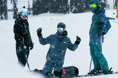 Comfortable tour bus transporting passengers through snowy terrain to Mt Buller