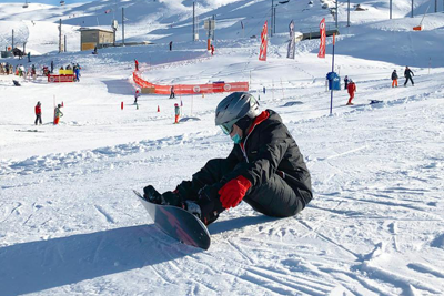 Range of ski equipment available for online hire, including skis, boots, and helmets